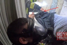 İş yerindeki yangında dumandan bayılan kişiyi itfaiye kurtardı; o anlar kask kamerasında