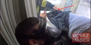 İş yerindeki yangında dumandan bayılan kişiyi itfaiye kurtardı; o anlar kask kamerasında