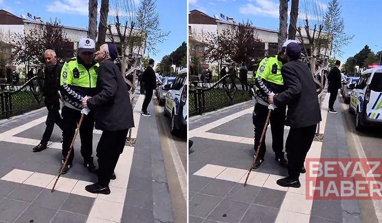 Kendisini yolun karşısına geçiren trafik polisini yanaklarından öptü
