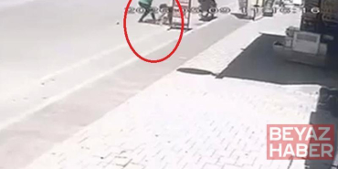 2 yaşındaki çocuğu, sokak ortasında tekmeledi