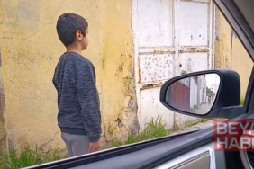 İstiklal Marşı’na yolda eşlik eden Emre’ye ödül