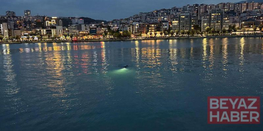 Ekipleri harekete geçiren deniz kıyısındaki eşyalar, profesyonel yüzücünün çıktı