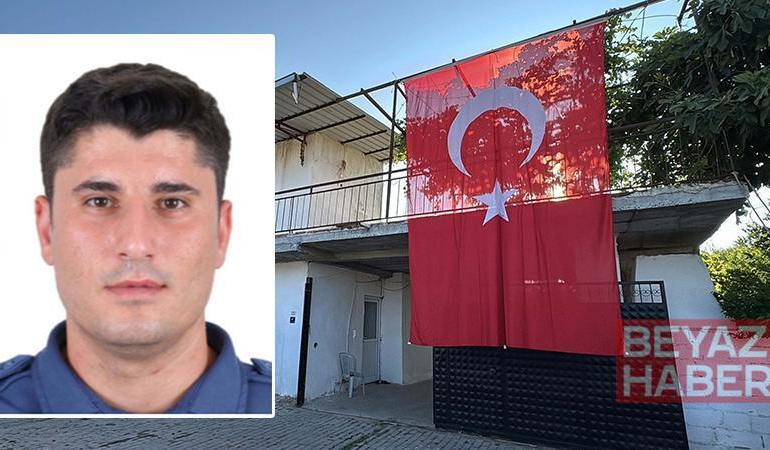 Şehit polis memurunun babaevine Türk bayrağı asıldı
