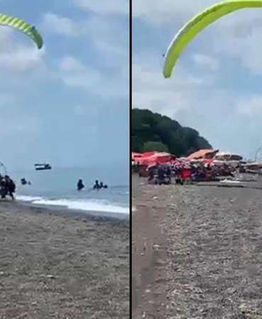 Sahilde motorlu yamaç paraşütüyle havalanırken tatilcilerin arasına daldı