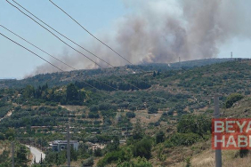 Çeşme’de çöplükte çıkan yangın, makilik alana sıçradı