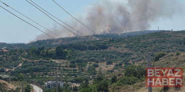 Çeşme’de çöplükte çıkan yangın, makilik alana sıçradı