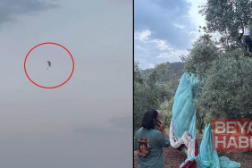 Paraşütleri rüzgarda savrulup zeytin ağacına takılan 2 kişi kurtarıldı; o anlar kamerada