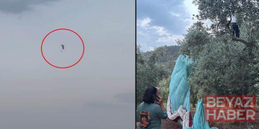 Paraşütleri rüzgarda savrulup zeytin ağacına takılan 2 kişi kurtarıldı; o anlar kamerada