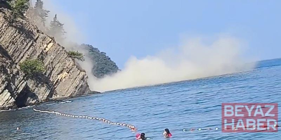 Denizde yüzerken 200 metre mesafede heyelan meydana geldi; o anlar kamerada