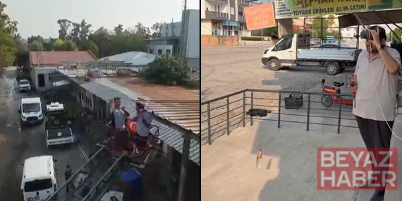 Patrondan çatıda güneş altında çalışan işçilere dronla soğuk içecek servisi