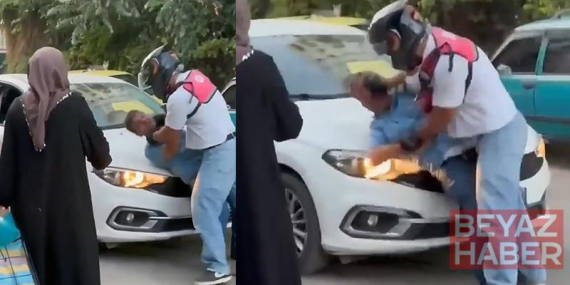 Yol verme tartışmasında motokurye, otomobil sürücüsünü kaputa yatırıp defalarca yumrukladı