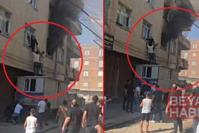 Yangında mahsur kalan kadını konteynerin üzerine çıkarak kurtardılar