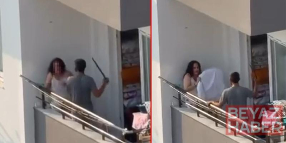 Balkonda tartıştığı kadını sopayla dövdü