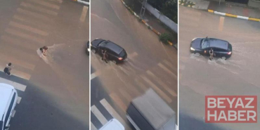 Sultanbeyli’de yağmur suyunda sürüklenerek yere düşen çocuğa sürücü yardım etti