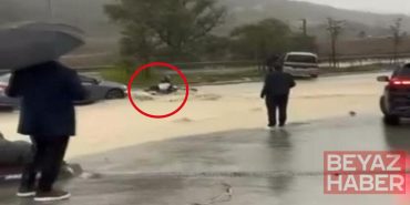 İstanbul'da yağmur suyuna kapılan motosikletliyi çevredekiler kurtardı